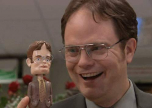dwight looking happy about his bobblehead